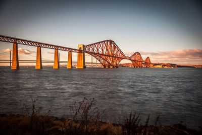 View of suspension bridge at sunset