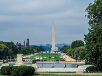 View of monument in park against cloudy sky