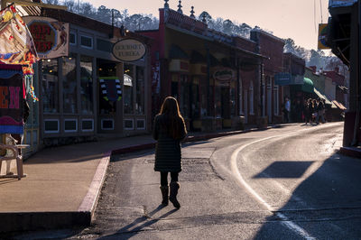 Rear view of woman walking in city