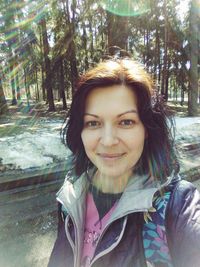 Portrait of smiling young woman outdoors