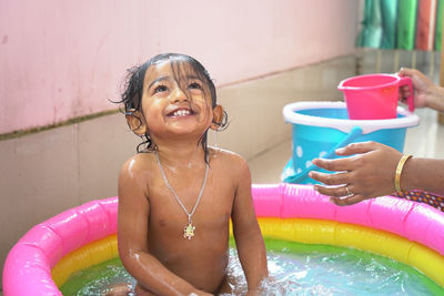 Portrait of young woman in water