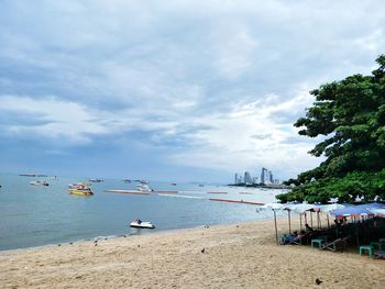 Boats moored on beach