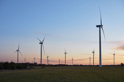 View of wind turbines at sunset