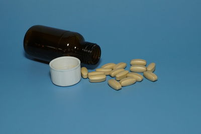 Close-up of bottle against blue background