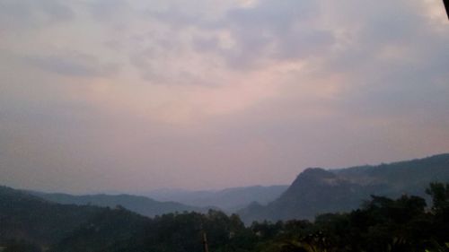 Scenic view of mountains against sky during sunset