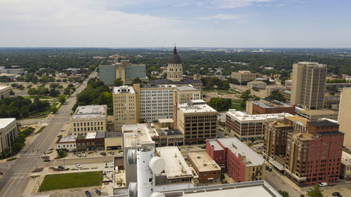 High angle view of buildings in city against sky