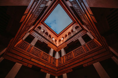 Low angle view of skylight seen through building