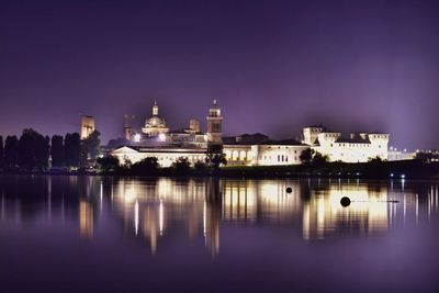 Reflection of illuminated buildings in water at night