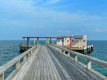 Pier over sea against sky