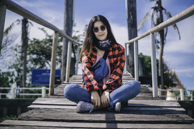 Portrait of woman sitting outdoors