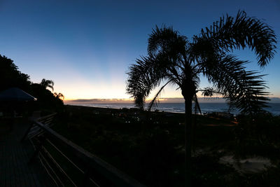 Scenic view of landscape against sky at sunset