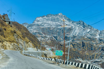 Road by mountains against clear blue sky. arunachal frontier highway .