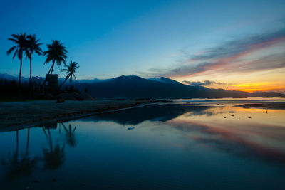 Scenic view of sea against sky at sunset