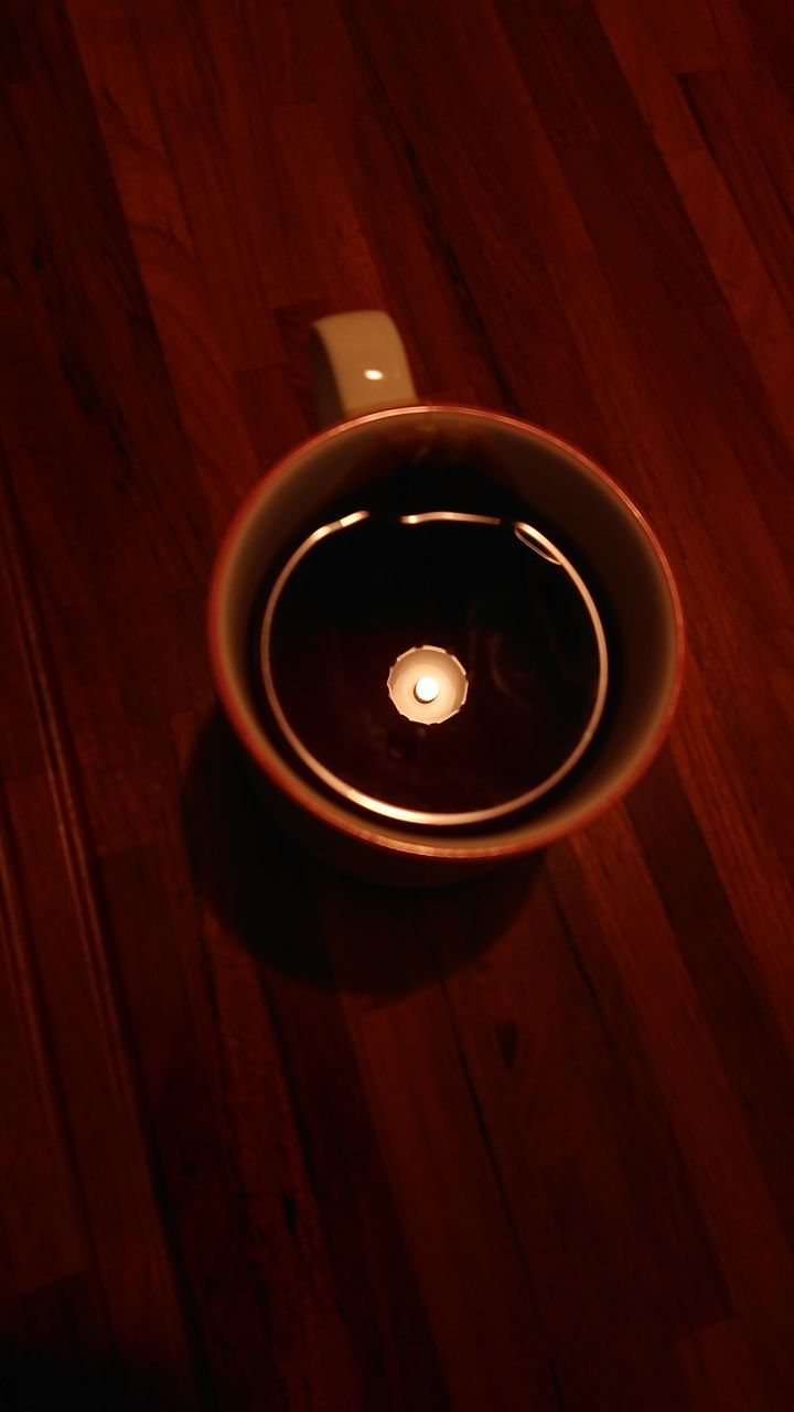 light, wood, darkness, circle, indoors, no people, table, high angle view, lighting, drink, directly above, food and drink, cup, refreshment