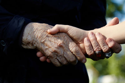 High angle view of hand holding hands