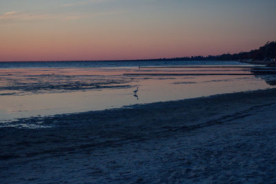 Scenic view of sea against sky at sunset