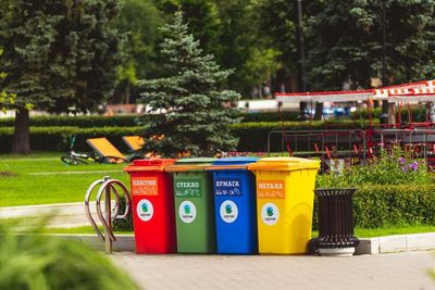Garbage bin against trees in park