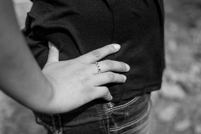 Midsection of woman wearing ring