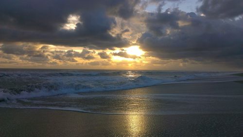 Scenic view of sea against cloudy sky