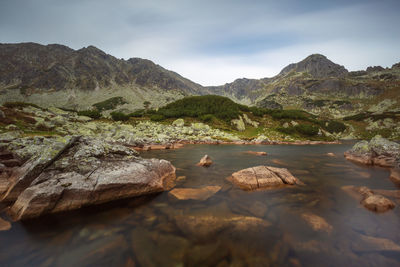 Rocks in mountains against sky