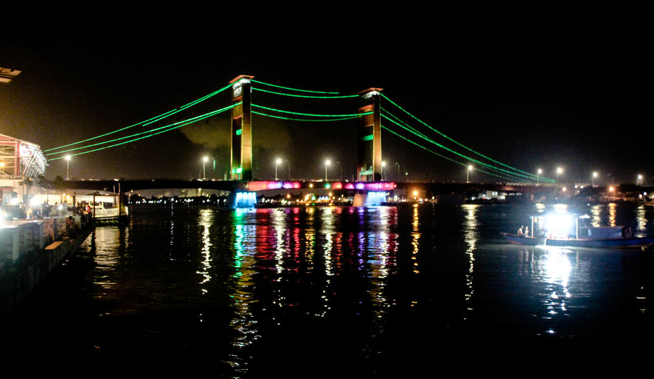 ILLUMINATED BRIDGE AT NIGHT