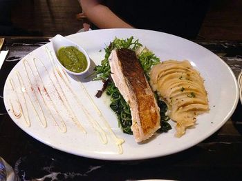 Close-up of hand served in plate on table