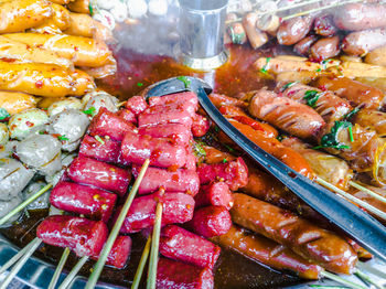 High angle view of meat on barbecue grill