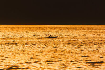 Scenic view of sea at sunset