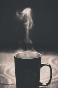 Close-up of coffee cup on table