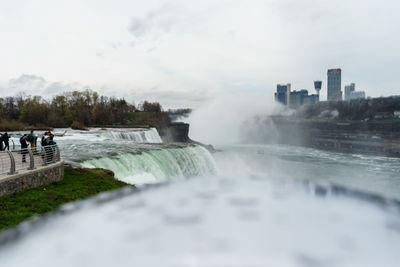 Scenic view of waterfall in city