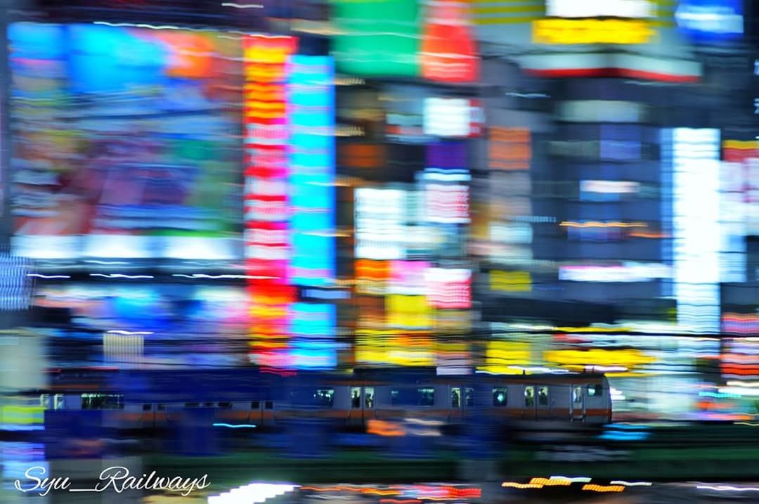 blurred motion, motion, transportation, multi colored, illuminated, speed, night, mode of transportation, business, no people, city, defocused, on the move, architecture, neon, car, traffic, city life, travel, street, nightlife, consumerism