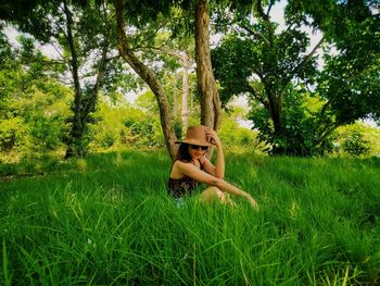 Portrait of young woman in field