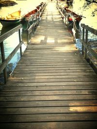 Empty wooden bridge over river