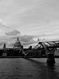 View of bridge over river against cloudy sky