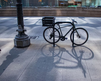 Bicycle parked on footpath in city