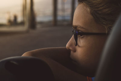 Close-up portrait of woman wearing eyeglasses