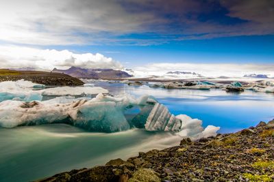 Scenic view of a ice lagoon against sky