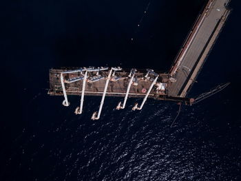 High angle view of illuminated lighting equipment against black background
