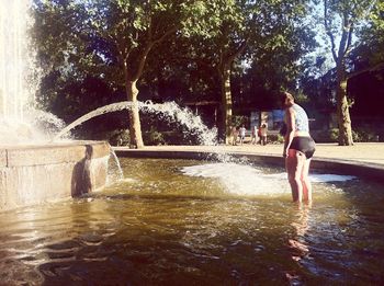 Water falling from fountain in park