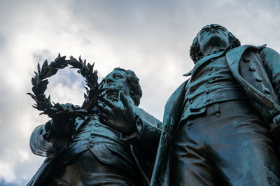 Low angle view of statue against sky