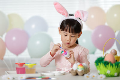 High angle view of girl with balloons