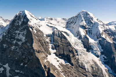 Snowcapped mountains against sky