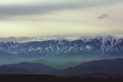 Scenic view of mountains against sky during sunset