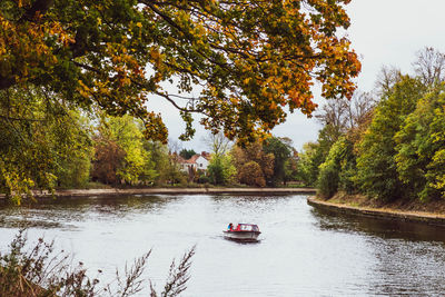 Scenic view of river amidst trees during autumn