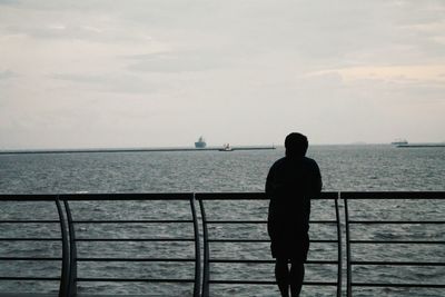 Man standing on pier