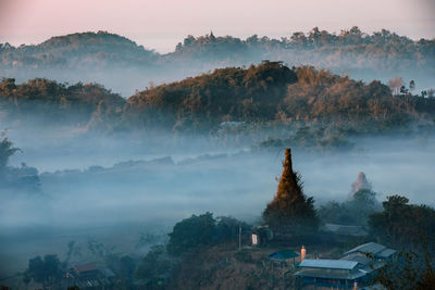 High angle view of trees and mountains against sky