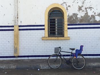 Bicycle parked in front of building