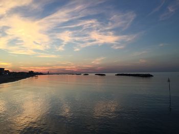 Scenic view of sea against sky at sunset