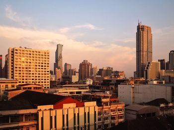 Modern buildings in city against sky