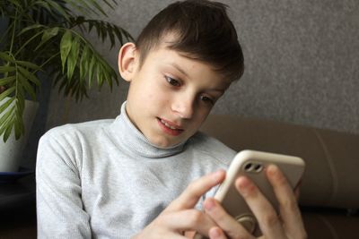 Boy using mobile phone